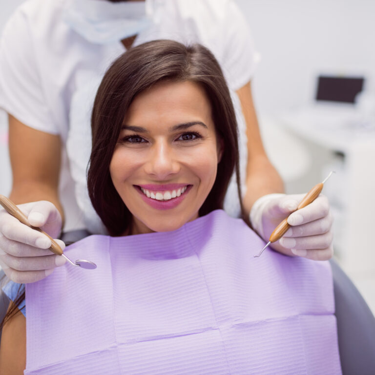 Portrait of female patient smiling in clinic